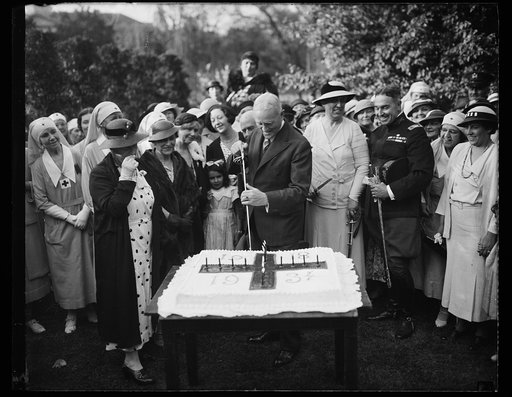 Man cutting cake, 1918-1934