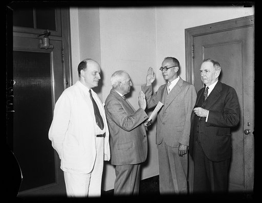 New Director, Bureau of Foreign and Domestic Commerce takes oath of office. Prof. Claudius T. Murchison, of Hickory, North Carolina, who has been named by President Roosevelt to be Director, Bureau of Foreign and Domestic Commerce of the U.S. Department of Commerce, took the oath of office this morn