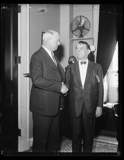When Congress closed. Postmaster General James A. Farley congratulating Sen. Kenneth McKellar of Tenn., on the passing of the resolution to simplify the airmail routes and contracts, during the last hours of Congress. This photo was made shortly after the 73rd Congress ajourned
