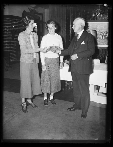 WINS MIDDLE ATLANTIC GOLF TITLE FOR WOMEN. This photograph shows the awarding of the prize to the new Middle Atlantic golf champion, Mrs. David H. Clark, Army & Navy Club of Washington. From the left Mrs. Clark, Miss Lily Harper, 19-year-old Portsmouth, Va., runner-up, and Charles H. Doing, Jr., pre