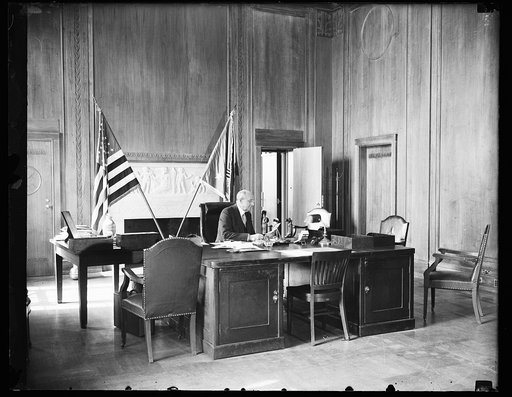Homer S. Cummings at desk