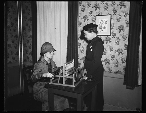 Scout weaving on loom