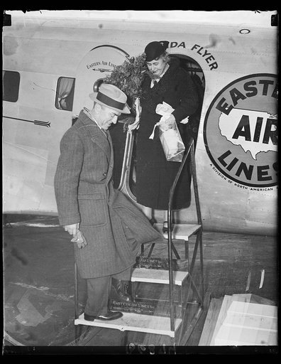 L to r: Capt. Eddie Rickenbacker, Mrs. W.W. Wilson completing her first extended plane trip. 1-17-35