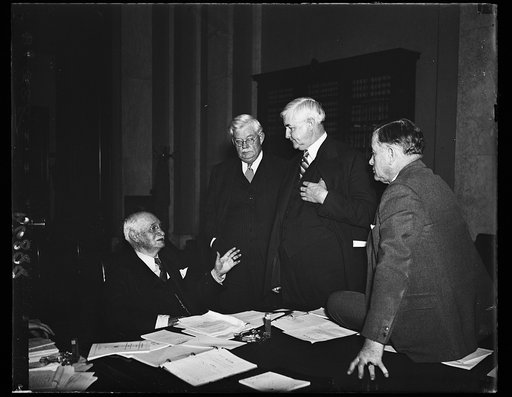 RFC extension conference. The Senate Banking and Currency Committee, headed by Sen. Duncan U. Fletcher, D. of Fla., left, listened to Jesse Jones, chairman of the RFC, while he explained why he believed the RFC should be extended. From the left: Sen. Fletcher, Sen. John G. Townsend, Jr. R of Del.; J