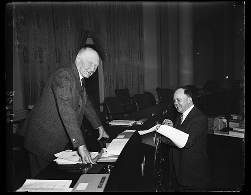Ways and Means Committee ready to act on pension bill. Rep. Robert L. Doughton, D. of N.C. chairman of the Ways and Means committee, left, listens to Edwin E. Witte, Executive Director of the Presidential Committee on Economic Security, as the committee considers various remifications of the old age