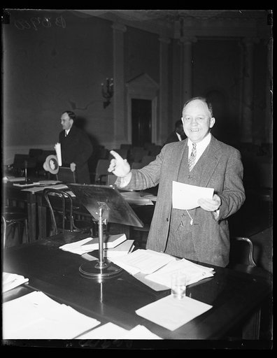 Economic Security Director. Edwin E. Witte, Executive Director of the Presidential Committee on Economic Security, explains the old age pension proposal of the president to the Ways and Means Committee of the House, 1/21/35