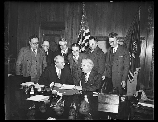Textile workers take grievance to DJ's. A committee from the United Textile Workers of America go to Attorney General Homer S. Cummings with a protest against mills refusing to abide by decisions of the Textile Labor Relations board. From the left, standing: Wm. F. Kelly, 2nd Vice President; Chester