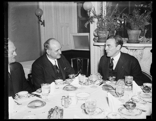 Honor Harvard football coach. Rep. J. Hamilton Fish, R. of N.Y. left, was host at a luncheon given in the speaker's dining room at the Capitol Wednesday in honor of Dick Harlow, new Harvard football coach. 1/23/35