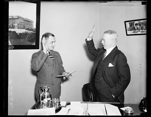 Prall takes office. Anning S. Prall, former Congressman of New York, right, takes oath of office as member of the Federal Communications Commission. The oath is administered by Herbert L. Pettey, secretary of the commission. 1/18/35