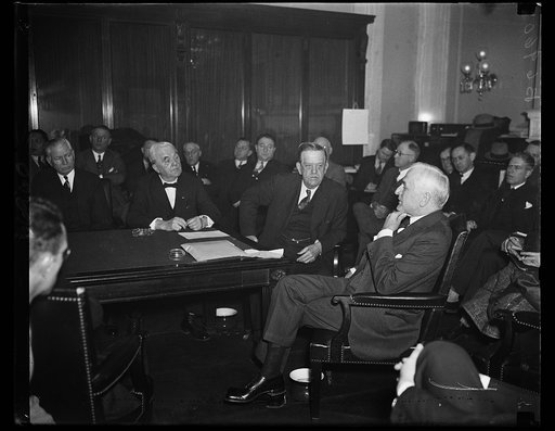 Foreign trade. Secretary of State Hull, extreme right, appears before the Senate Agriculture committee and advocates lower tariffs. He said, "we should not furnish protection to every antiquated business firm in the country by unreasonably high tariffs"