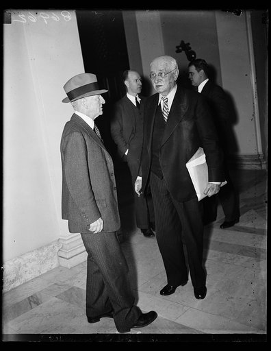 Will the gentleman yield? The senator from Virginia, Carter Glass, left, apparently has the right-of-way over Sen. Duncan U. Fletcher, D. of Fla., as the two meet at a corner of a hallway in the Senate office building. Sen. Glass has been busy lately baiting Marriner Eccles, governor of the Federal 