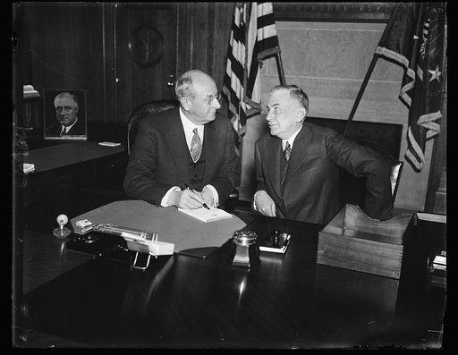 New member, U.S. Parole Board. Dr. Charles C. Whelan of Birmingham, Ala., right, becomes a member of the United States Board of Parole. He appears here with Attorney General Homer Cummings. Dr. Whelan is an M.D., and has practiced for many years in Birmingham. 2/1/35