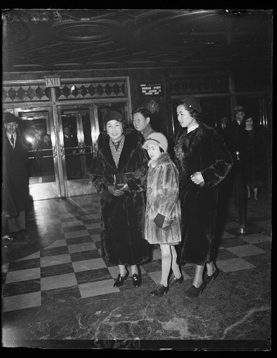 Chinese Minister's family attend theatre. The March of Time, a motion picture release, attracted representatives of foreign governments when it was shown in Washington. This group, from the left, Madame Sao-Ke Alfred Sze, wife of the minister, and their two daughters, Julia and Alce. The young gentl