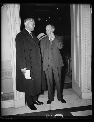 The Jones boys. Jesse Jones, chairman of the RFC, left, is surprised by Rep. Marvin Jones, also of Texas, and the RFC head waited around the Capitol as action was taken on the extension of the RFC. Rep. Jones is Chairman of the House Agriculture Committee