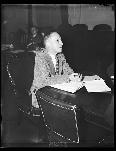 At security hearing. Paul Kellogg, New York City, appears before the Senate Finance Committee considering the Economic Security Act. Kellogg is Editor of Survey Graphic and Vice Chairman of the Advisory Council to the Committee on Economic Security. 2/14/35