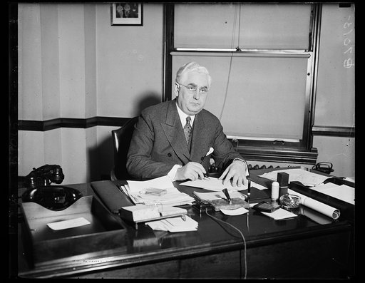 Leo. T. Crowley, of the Federal Depost Insurance Corporation, photographed at his desk. 2/14/35