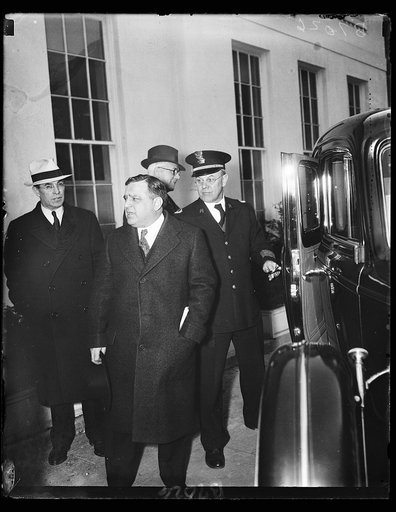 LaGuardia leaves White House. Mayor F. LaGuardia of New York City talks with President Roosevelt about a billion dollar work progress and leaves the White House without a specific comment. He is being helped to his car by Lt. Larry Seeman, veteran White House office. 2/11/35