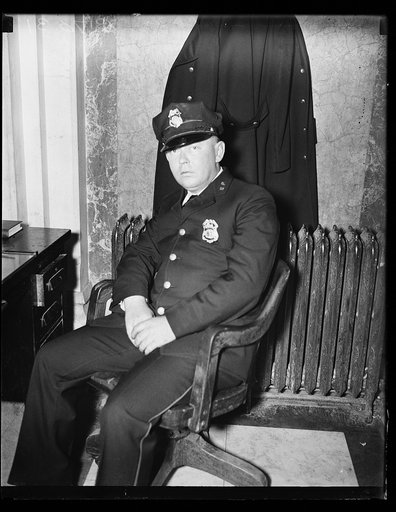A Slap at Huey? Fred. C. Parker, alleged life threatener of Sen. Huey Long, as he appeared at his post of duty in the House office building where, as a patronage progidy of Rep. Jared Y. Sanders, Jr., of La., he works as a member of the Capitol police force. Parker, a resident of Baton Rouge, La., d