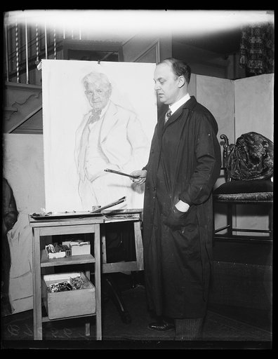 Artist with sketch of Henry T. Rainey