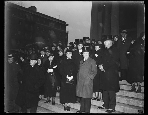Group on steps; Harold Ickes and James Farley front, center
