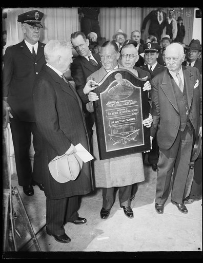 John Nance Garner, left; plaque: "Presented by the people of Daytona Beach to Sir Malcolm Campbell ...