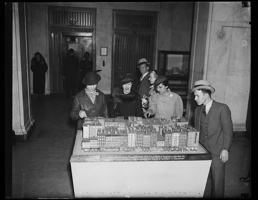 People viewing building exhibit