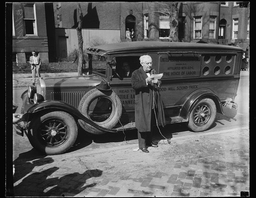 Man with United Textile Workers of America truck near Samuel Gompers Memorial, Washington, D.C.