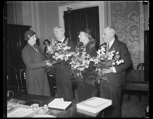 Group with flowers; George Norris, 2nd from left