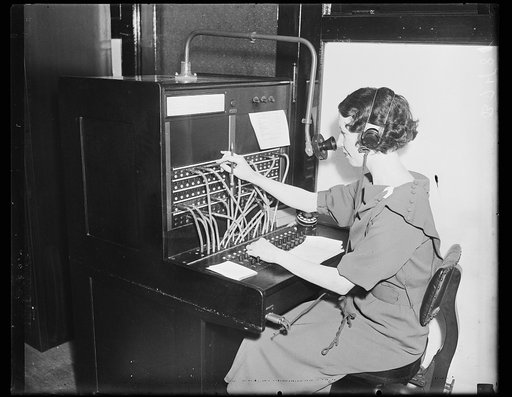 Woman working at switchboard
