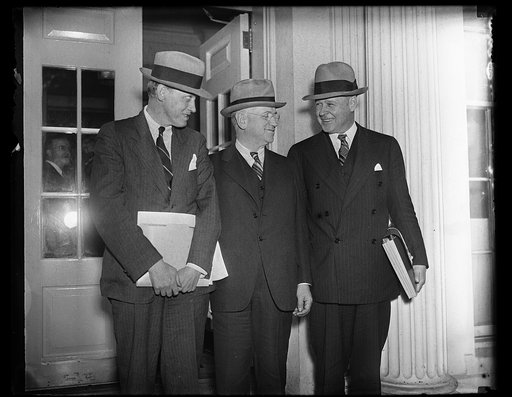 Harry Hopkins, left and Harold Ickes, center. White House, Washington, D.C.