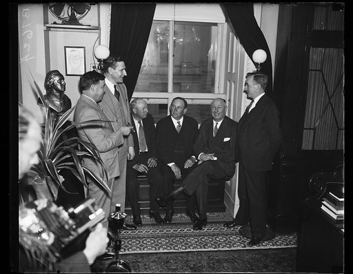 Group: Pat Harrison, Joseph Robinson and James Farley seated in window
