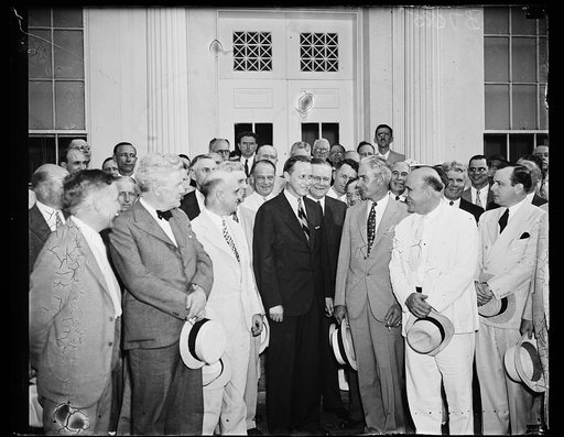 Group at White House; Harry Hopkins, center. Washington, D.C.