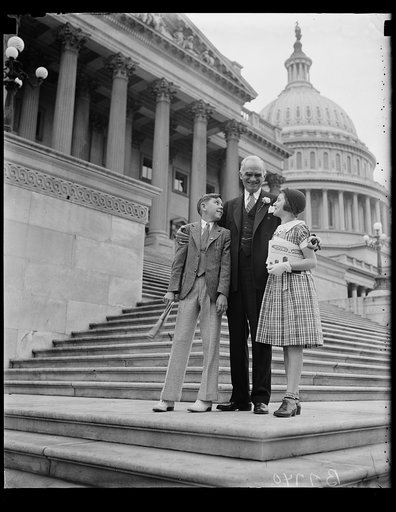 Joseph Byrns and children on steps of U.S. Capitol, Washington, D.C.