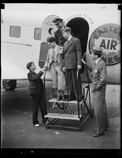 Unidentified group of boys at Chicago Flyer, Eastern Airlines airplane door