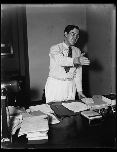 Rush D. Holt at desk
