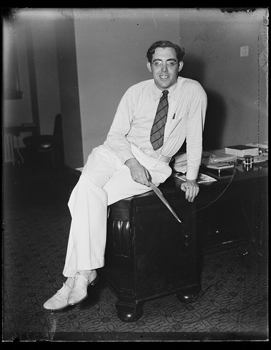 Rush D. Holt at desk