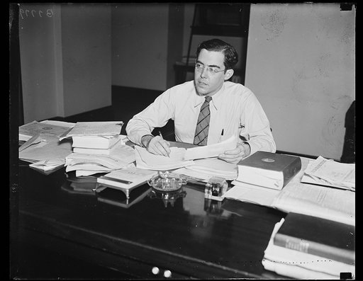 Rush D. Holt at desk