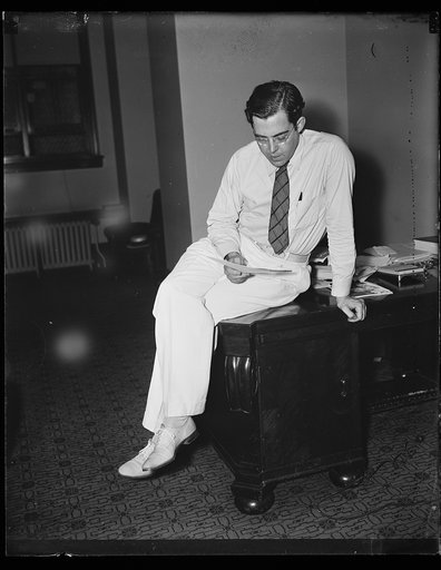 Rush D. Holt at desk