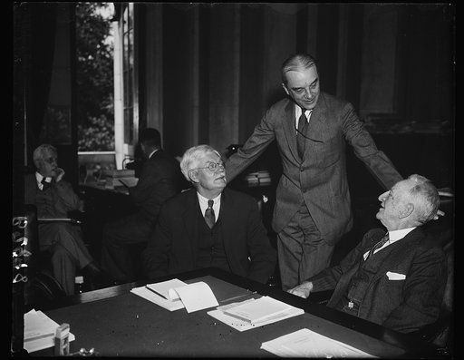 L to r: Sen. John G. Townsend, R. of Del.; Owen D. Young of Gen. Electric, Sec. Carter Glass, D. of Va. at bank bill swearing. 5-31-35