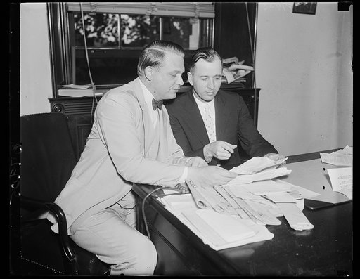 Urge alien importation. Rep. Martin Dies, left, Texas Democrat and author of H.R. 7120 to deport some six million aliens now said to be in the U.S. confers with Rep. Joe Starnes, Alabama Democrat, regarding the bill. Starnes reported the bill for Dies. 6/24/35