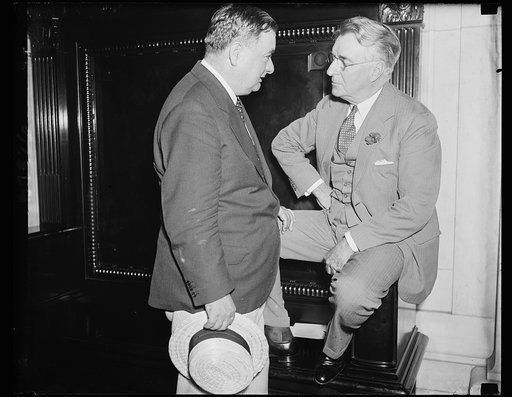 May get graft quiz order. Joseph B. Keehan, Assistant Attorney General, left, talks with Sen. Royal S. Copeland, D. of N.Y., at the Senate Commerce Committee which is hearing the graft charges of Ewing Y. Mitchell, ousted Assistant Secretary of Commerce, who wants the G-men to carry on the investiga