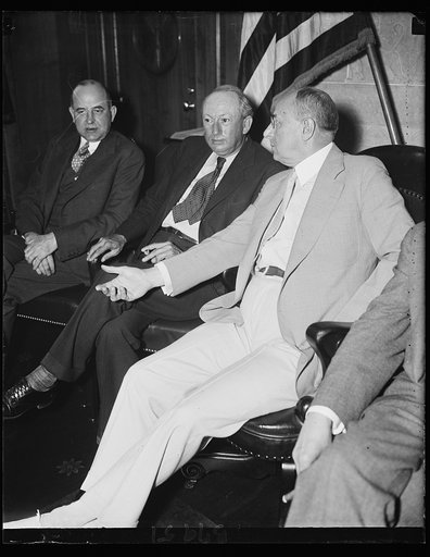 An opinion needed. Sen. Pat Harrison, D. of Mass., left, gets some advice from Attorney General Homer S. Cummings concerning the bill written by Sen. Harrison in the Senate Finance Committee for the extension of the NRA. The Supreme Court yesterday declared certain features of the old act unconstitu