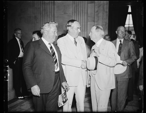 Senate passes on commerce tangle. Members of the Senate Commerce Committee and Secretary Daniel C. Roper, right, discuss phases of the charges hurled by ousted Assistant Secretary Ewing Y. Mitchell that graft exists in several bureaus of the Commerce Department. From the left: Sen. Pat McCarran, D. 