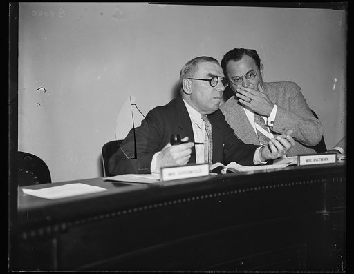 Plotting for lobbies. Rep. Sol Bloom, D. of N.Y., left, and Rep. Wright Patman, D. of Tex., going into a hasty conference as they sit in a Special House Committee investigating "super lobbies" and come out with a [subpena?] for Robert W. Lyons, Counsel for several chain stor [...] 8/9/35