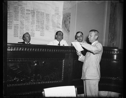 William A. Hill, Boston, Attorney for Howard C. Hopson, utility emperor, appears before the Senate Lobby Investigating Committee in the morning. In the afternoon the committee asked for a contempt citation for Hill, after the committee had asked for a similar citation for Hopson. In this picture, fr