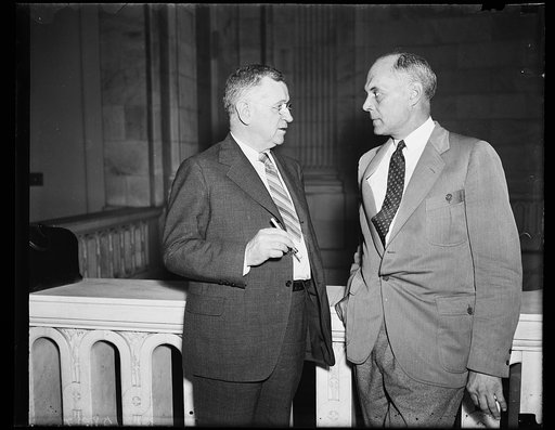 Take part in hearings. Sec. of Int. Harold L. Ickes, left, and Louis R. Glavis, Director of Inves. of the Int. Dept. and Public Works, confer during a recess in the Senate Investigation of the Virgin Islands administration. 7/2/35