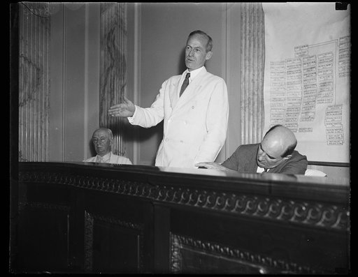 Tydings said he didn't. Sen. Millard E. Tydings, D. of Md., standing, injected himself into the Senate lobby investigating committee where he questioned B.B. Robinson, the utility lobbyist, concerning the statement made by Robinson that he, Tydings, had attended a cocktail party. Sen. Tydings said h