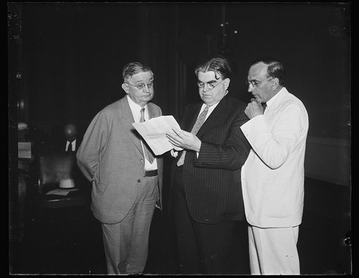 Mine workers cite sick chicken case to aid coal bill. Henry Warrum, left, United Mine Workers' General Counsel, cites the Supreme Court's decision on the famous NRA sick-chicken case as supporting the constitutionality of the Guffey Coal bill. He testified before a sub-committee of the House Ways an