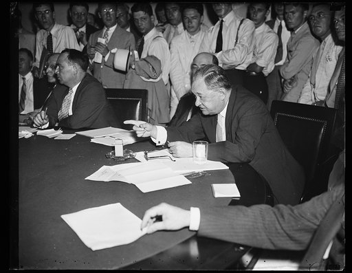 Wash. D.C. Cross examiner. Rep. Frederick R. Lehlbach (R. of N.J.) of the House Rules Lobby Investigation snapped as he fired questions regarding lobbying and vote influencing practices, at Thomas G. Corcoran, New Deal Brain Tester, who has been accused of using pressure on Rep. Ralph Brewster's vot