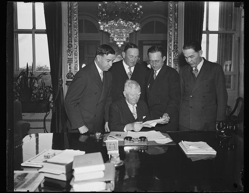 John Nance Garner at table with group; includes Joseph T. Robinson, center